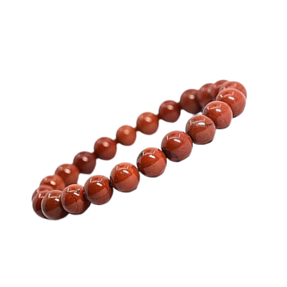 Pulseira de Jaspe Vermelho natural com esferas de 8 mm, tradicionalmente associada à força, vitalidade, coragem e estabilidade emocional.