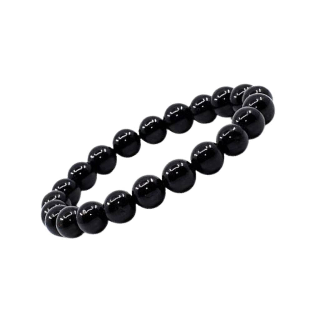 Pulseira de Turmalina Negra natural com esferas de 8 mm, tradicionalmente associada à proteção energética, estabilidade e ancoramento.