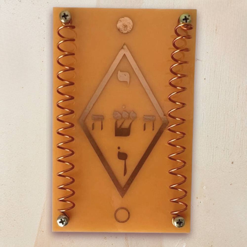 Telerradiador em fenolite com símbolo místico Yoshua em cobre para utilização em práticas de Radiestesia e Radiónica.