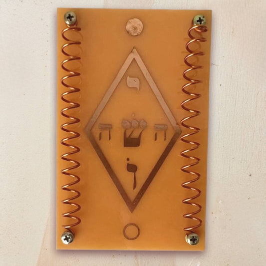 Telerradiador em fenolite com símbolo místico Yoshua em cobre para utilização em práticas de Radiestesia e Radiónica.